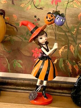 New orange and black stripe Halloween witch holding balloons decoration
